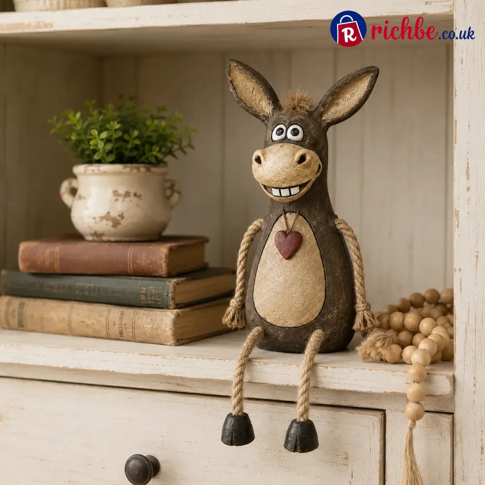 Rustic figurine of a donkey on a plank with rope legs hanging down