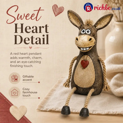 Rustic figurine of a donkey on a plank with rope legs hanging down
